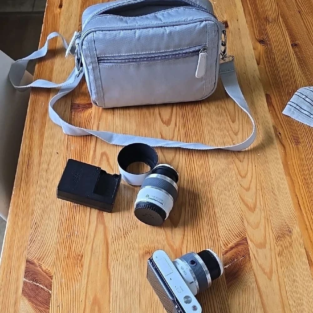 Compact Silver Camera with Accessories
